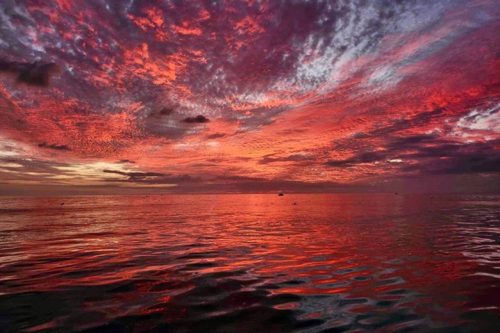 a sunset over a body of water